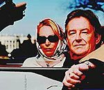 Valerie Plame and her husband, Joseph Wilson, play 'I Spy' in front of the White House. Val won with 'I spy Dick Cheney's comeuppance.'